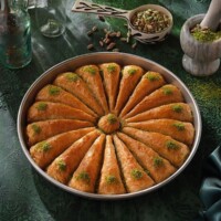 Koskeroglu Carrot Slice Baklava with Pistachio on a Tray